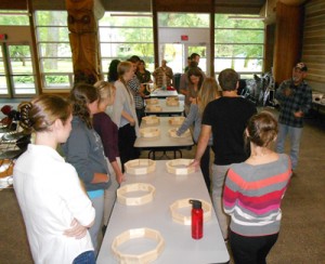 Medical students participate in a traditional drum making session led by Elder Old Hands.